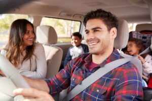 Family inside car on family road trip.